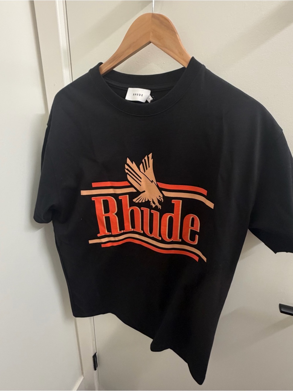Rhude Black Tee with Red-Orange and Cream Graphic